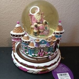 The NWT Christopher Radko Candy Castle Snowglobe